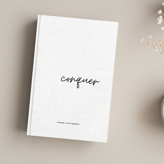 CONQUER: A MINIMALIST MOTIVATIONAL NOTEBOOK